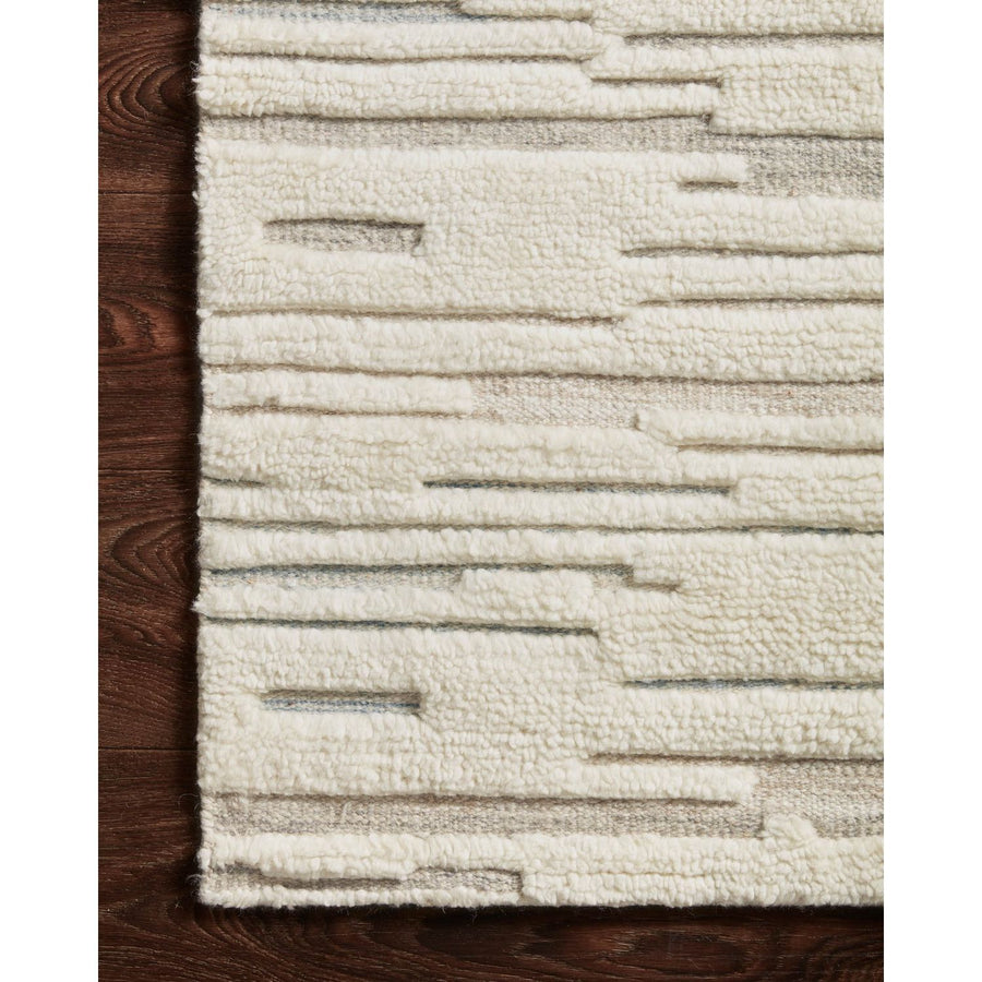 Dimensional yet soft, the Bennett Ivory / Mist Area Rug is hand-knotted of wool, viscose and polyester in India. Featuring a new carve like high-low pile, Bennett has an ivory base with abstract tonal designs. Plus, it's plush underfoot -- a great choice for your office, bedroom, or other medium traffic areas.   Hand Knotted 45% Wool | 32% Viscose | 17% Polyester | 6% Other Fibers Pile BEN-02 Ivory/Mist