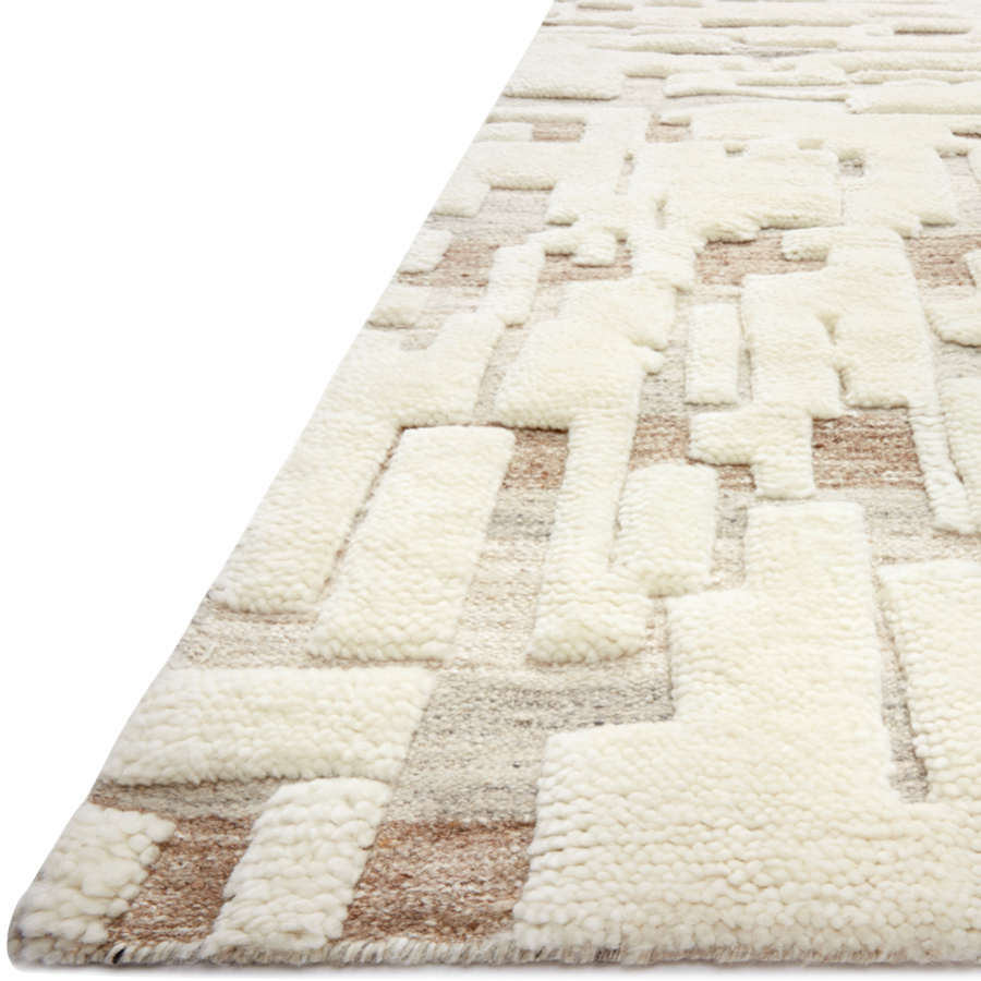The Loloi Bennett Ivory / Taupe Area Rug, or BEN-05, is hand-knotted of wool, viscose and polyester in India. Featuring a new carve like high-low pile, Bennett has an ivory base with abstract tonal designs. Plus, it's plush underfoot-- a great choice for your office, bedroom, or other medium traffic areas. 