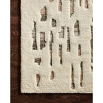 The Loloi Bennett Ivory / Forest Area Rug, or BEN-06, is hand-knotted of wool, viscose and polyester in India. Featuring a new carve like high-low pile, Bennett has an ivory base with abstract tonal designs. Plus, it's plush underfoot-- a great choice for your office, bedroom, or other medium traffic areas. 