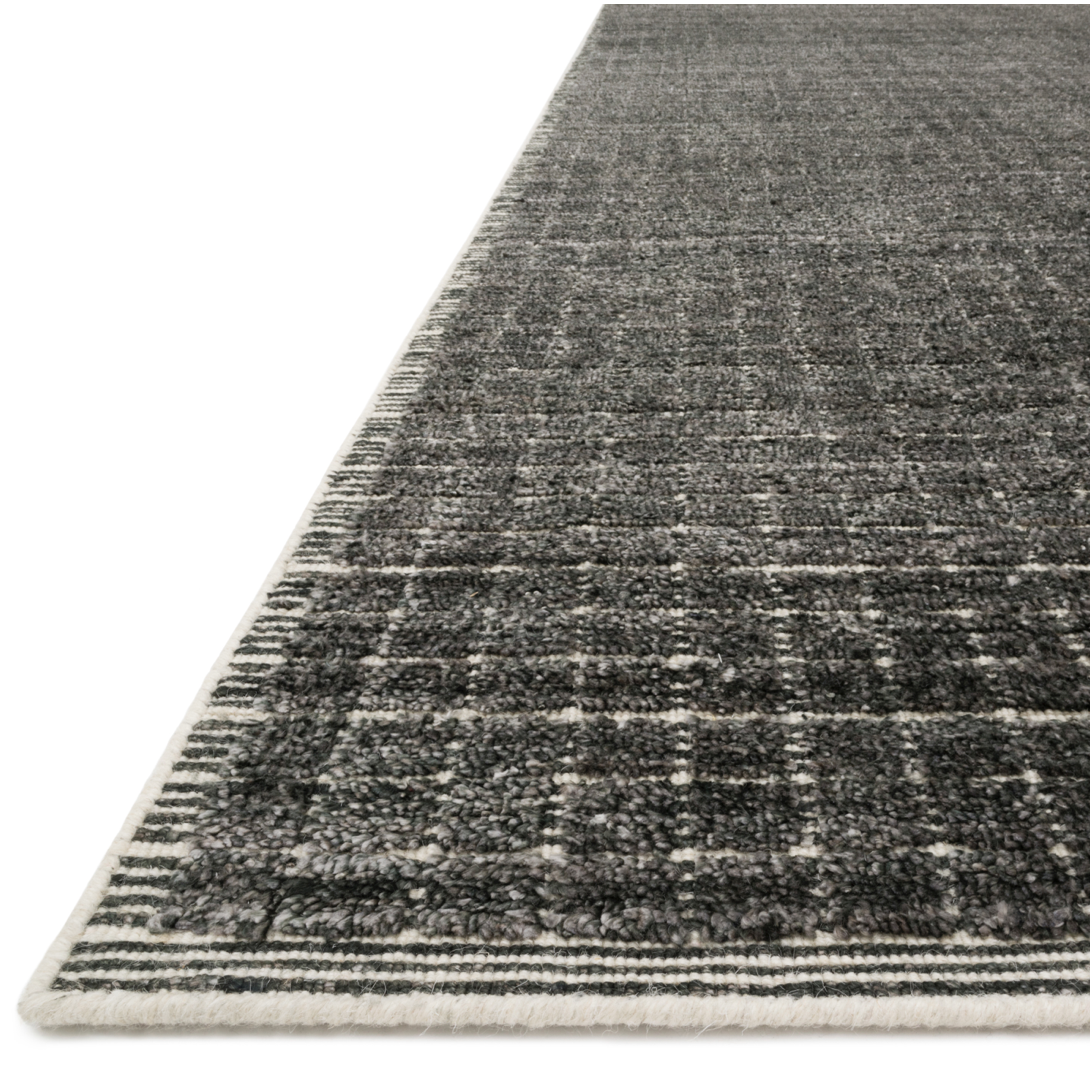 Modern and refined, the Beverly Charcoal rug from Loloi is hand-loomed by master artisans of viscose and wool pile. Clean lines and minimalist hues allow you to layer Beverly into any room.  Hand Loomed 70% Viscose | 30% Wool BEV-01 Charcoal
