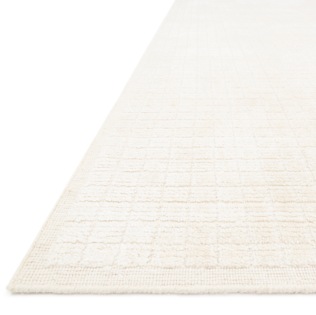 Modern and refined, the Beverly Ivory rug from Loloi is hand-loomed by master artisans of viscose and wool pile. Clean lines and minimalist hues allow you to layer Beverly into any room.  Hand Loomed 72% Viscose | 28% Wool BEV-01 Ivory