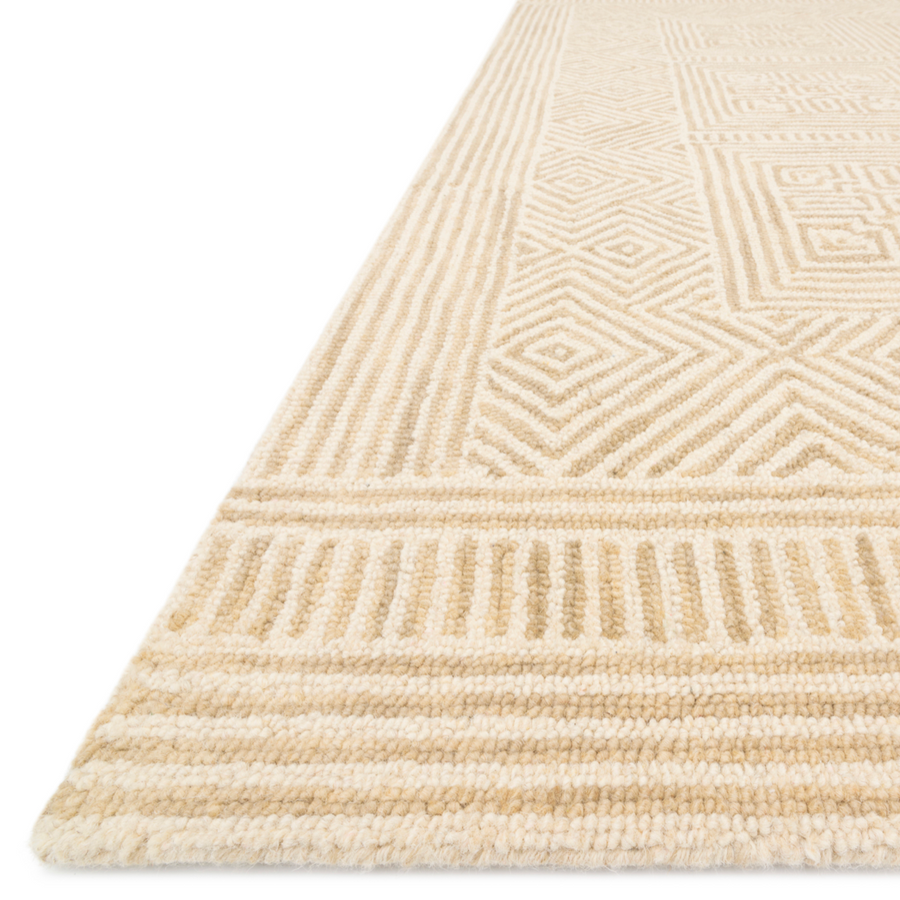 The Boceto Ivory / Sand area rug is hand-tufted of 100% wool by skilled artisans for an easy to care and maintain rug. The rug features stunning colors of ivory and sand and brings a warm texture to the room. The design offers textural, linear and precise detail giving the Boceto Ivory / Sand area rug a refined yet playful vibe. The Boceto Rug Collection is crafted by Loloi for ED Ellen DeGeneres.  Hand-Tufted 100% Wool BOC-01 ED Ivory / Sand Colors: Ivory, Sand