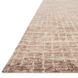 Inspired by textural watercolors, the Giana Blush Area Rug combines a relaxed grid with soft variations of cream and blush for an effortless and sophisticated look. Each area rug is hooked of 100% wool by artisans for a beautiful textural layer to your home. The soft textures of this area rug bring warmth and coziness to any room.  Hooked 100% Wool GH-01 Blush