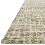 Inspired by textural watercolors, the Giana Granite Area Rug combines a relaxed grid with soft variations of cream and beige for an effortless and sophisticated look. Each area rug is hooked of 100% wool by artisans for a beautiful textural layer to your home. The soft textures of this area rug bring warmth and coziness to any room.  Hooked 100% Wool GH-01 Granite