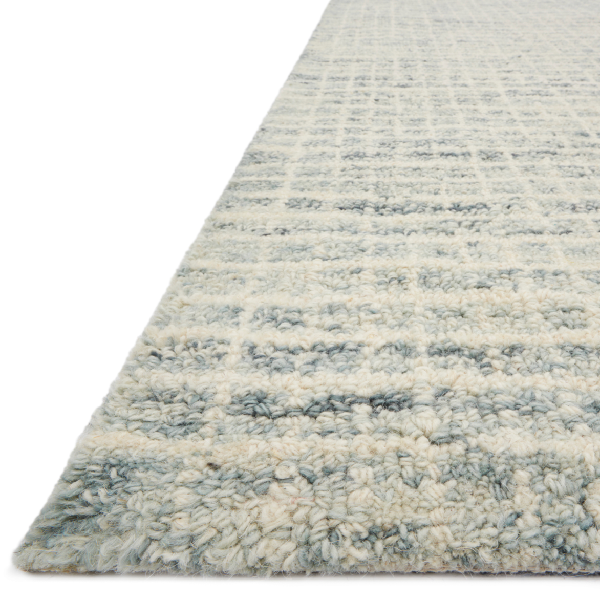 Inspired by textural watercolors, the Giana Spa Area Rug combines a relaxed grid with soft variations of cream and blue for an effortless and sophisticated look. Each area rug is hooked of 100% wool by artisans for a beautiful textural layer to your home. The soft textures of this area rug bring warmth and coziness to any room.  Hooked 100% Wool GH-01 Spa