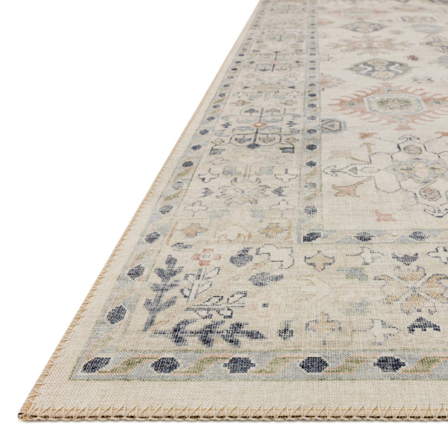 Featuring soft motifs in a carefully curated color palate of beige, ivory, and hints of black, the Hathaway Beige / Multi area rug captures the essence of one-of-a-kind vintage or antique area rug at an attractive price.