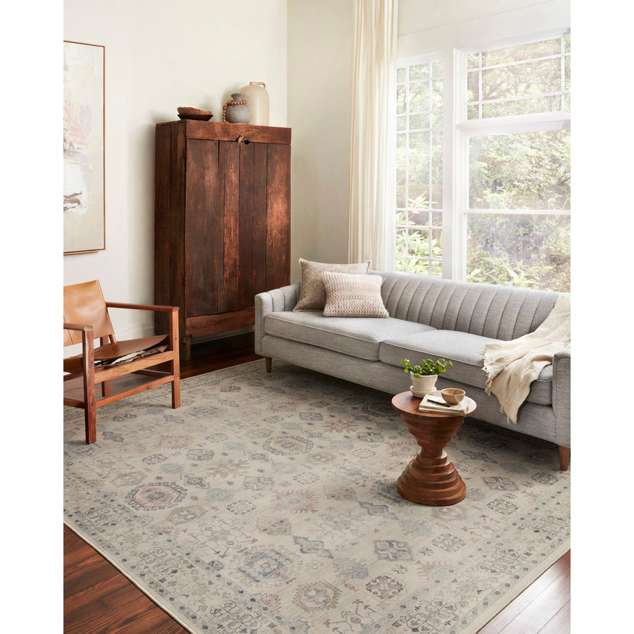Featuring soft motifs in a carefully curated color palate of beige, ivory, and hints of black, the Hathaway Beige / Multi area rug captures the essence of one-of-a-kind vintage or antique area rug at an attractive price.