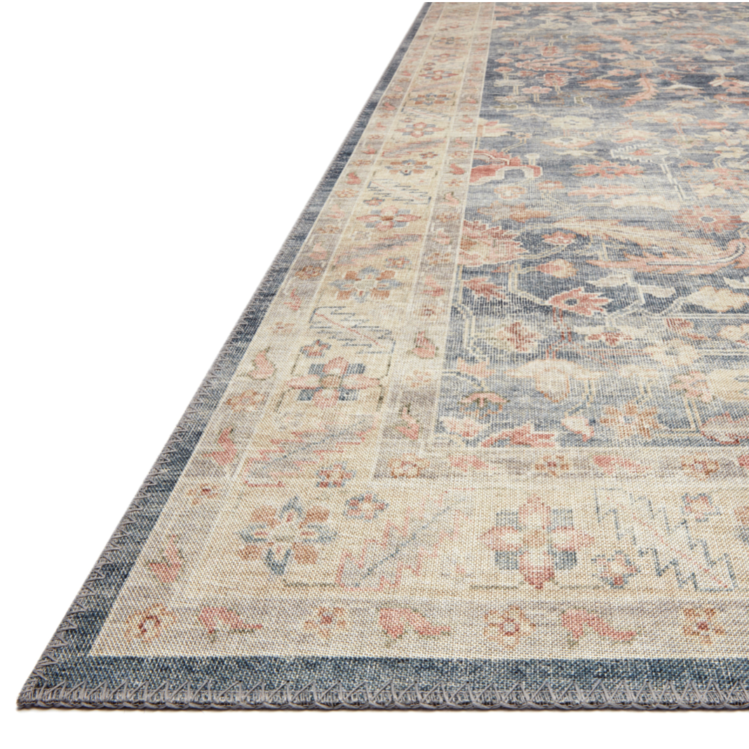 Featuring soft motifs in a carefully curated color palate of blue, yellow, red, and hints of orange, the Hathaway Denim / Multi area rug captures the essence of one-of-a-kind vintage or antique area rug at an attractive price.