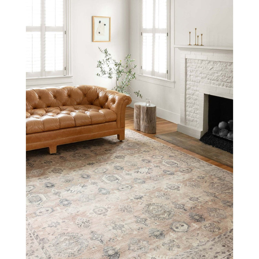 Featuring soft motifs in a carefully curated color palate of ivory, red, grey, and hints of blue, the Hathaway Java / Multi area rug captures the essence of one-of-a-kind vintage or antique area rug at an attractive price.