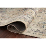 Featuring soft motifs in a carefully curated color palate of ivory, blue, green, and hints of purple, the Hathaway Multi / Ivory area rug captures the essence of one-of-a-kind vintage or antique area rug at an attractive price.
