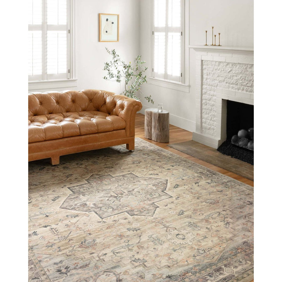Featuring soft motifs in a carefully curated color palate of ivory, blue, green, and hints of purple, the Hathaway Multi / Ivory area rug captures the essence of one-of-a-kind vintage or antique area rug at an attractive price.