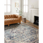 Featuring soft motifs in a carefully curated color palate of black, blue, yellow, and hints of orange, the Hathaway Navy / Multi area rug captures the essence of one-of-a-kind vintage or antique area rug at an attractive price.