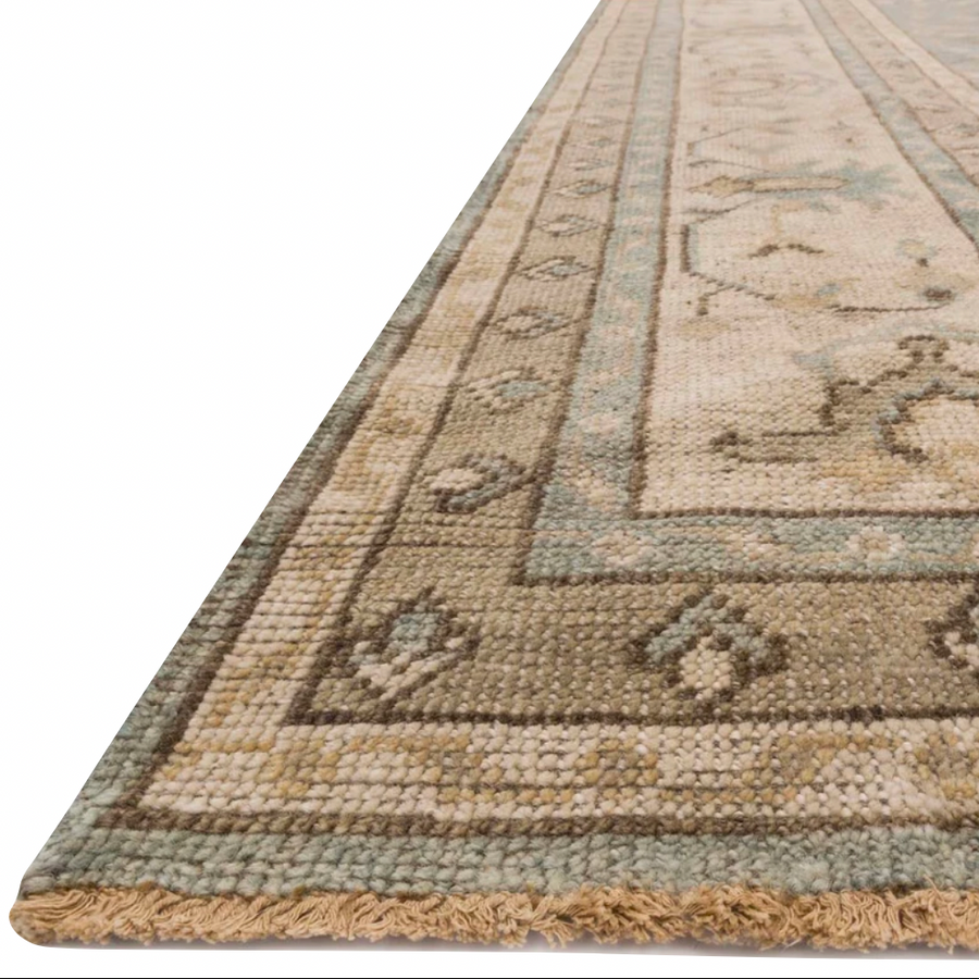 Bring a touch of antiqued beauty into your home with the Heirloom Aqua / Stone HQ-05 rug from Loloi. This wool rug tastefully honors the art of hand knotted rugs. This rug would be perfect for a living room, dining room, bedroom, hallway or kitchen runner with it's patterns and calming tones for your home.