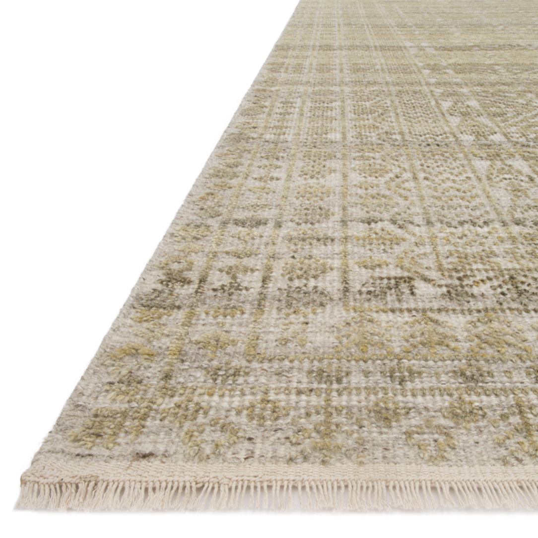 Both timeless and modern, the Idris area rug collection from Loloi is meticulously hand-knotted of viscose and wool. The tonal series features an elevated texture, accentuating the pattern in every piece.  Hand-Knotted 70% Viscose | 30% Wool ID-02 Beige/Straw