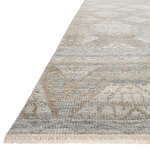The Idris Granite/Sand area rug from Loloi is meticulously hand-knotted of viscose and wool. You will love this rug because the rug is:  Perfect for entryways, living rooms, and bedrooms Easy to clean and maintain Gorgeous with the intricate pattern and patina Warms up any room with the high / low pile Hand-Knotted 70% Viscose | 30% Wool ID-01 Granite/Sand