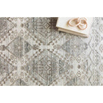 The Idris Stone area rug from Loloi is meticulously hand-knotted of viscose and wool. You will love this rug because the rug is:  Perfect for entryways, living rooms, and bedrooms Easy to clean and maintain Gorgeous with the intricate pattern and patina Warms up any room with the high / low pile Hand-Knotted 70% Viscose | 30% Wool ID-01 Stone