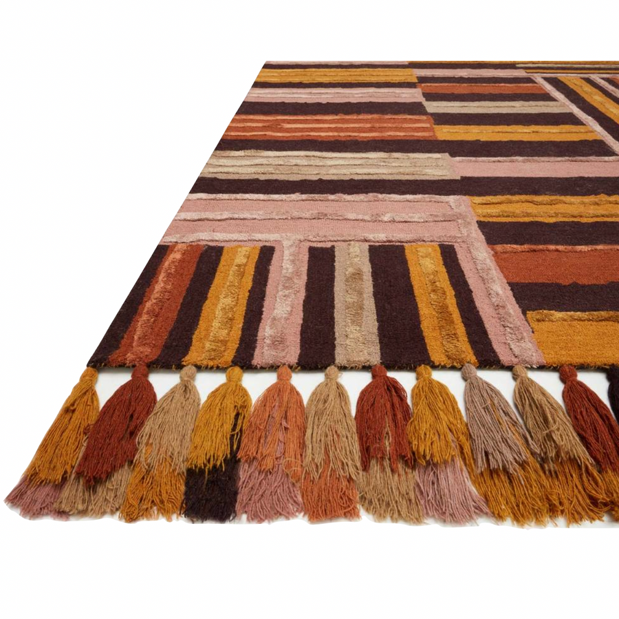 The Jamila Spice/Bordeaux Area Rug is hooked of wool and viscose by artisans in India and offers next level bohemian and eclectic designs. Designed by Justina Blakeney for Loloi, the collection features playful tassels and bold yet current colors, instantly adding personality in any space. Perfect for a bedroom, bathroom, or other low-traffic spaces in your home.   Hooked Wool | Viscose Pile JAA-04 JB Spice/Bordeaux