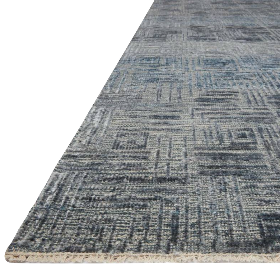 Featuring tone on tone geometric patterns, the Lana Denim Area Rug is hand-knotted of wool, viscose and cotton. Crafted in India, the refined high-low pile is a testament to the dedication of craftsmanship required to create each area rug. This would go great in a living room, kitchen, or other medium to high-traffic areas.   Hand Knotted 41% Wool | 39% Viscose | 18% Cotton | 2% Other Fiber Pile LNA- 01 Denim 