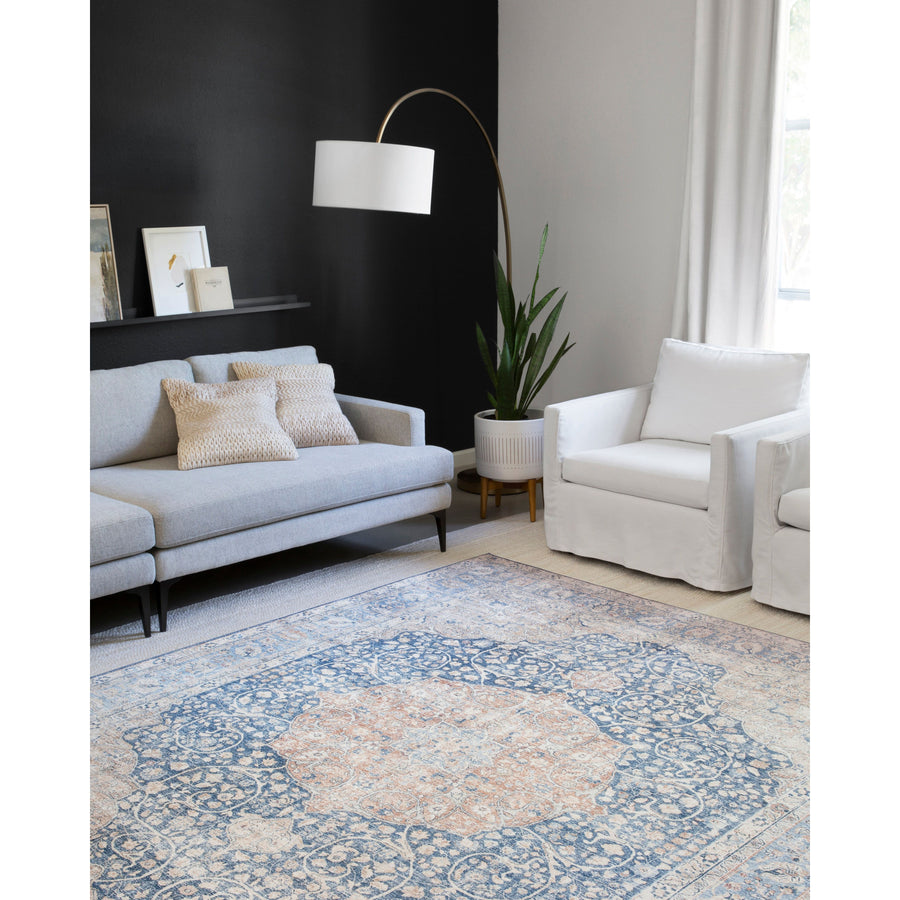 The Layla Collection is traditional and timeless, with a beautiful lived-in design that captures the spirit of an old-world rug. This traditional power-loomed rug is crafted of 100% polyester with a classic and sophisticated color palette and subtle patina.  Power Loomed 100% Polyester LAY-07 Blue/Tangerine