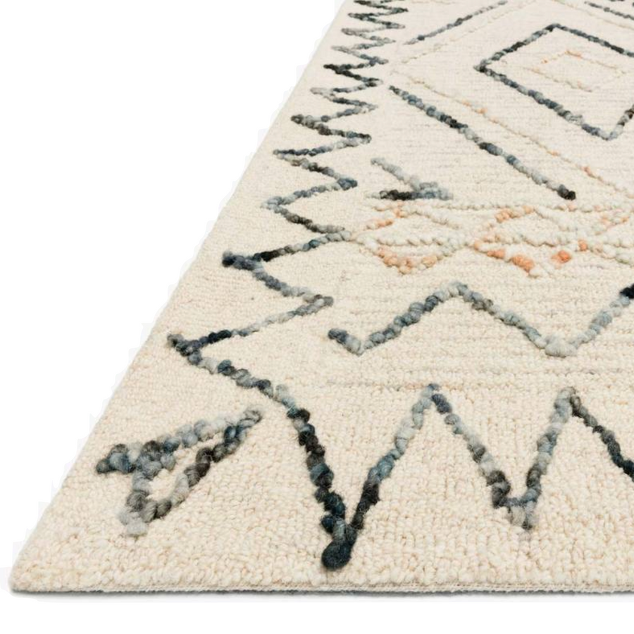 Inspired by abstract and geometric freehand art, the Oatmeal / Denim Rug is designed by Justina Blakeney. Hooked of 100% wool pile, the designs create the illusion of visual movement.  Hand Tufted 100% Wool LEE-02 Oatmeal/Denim