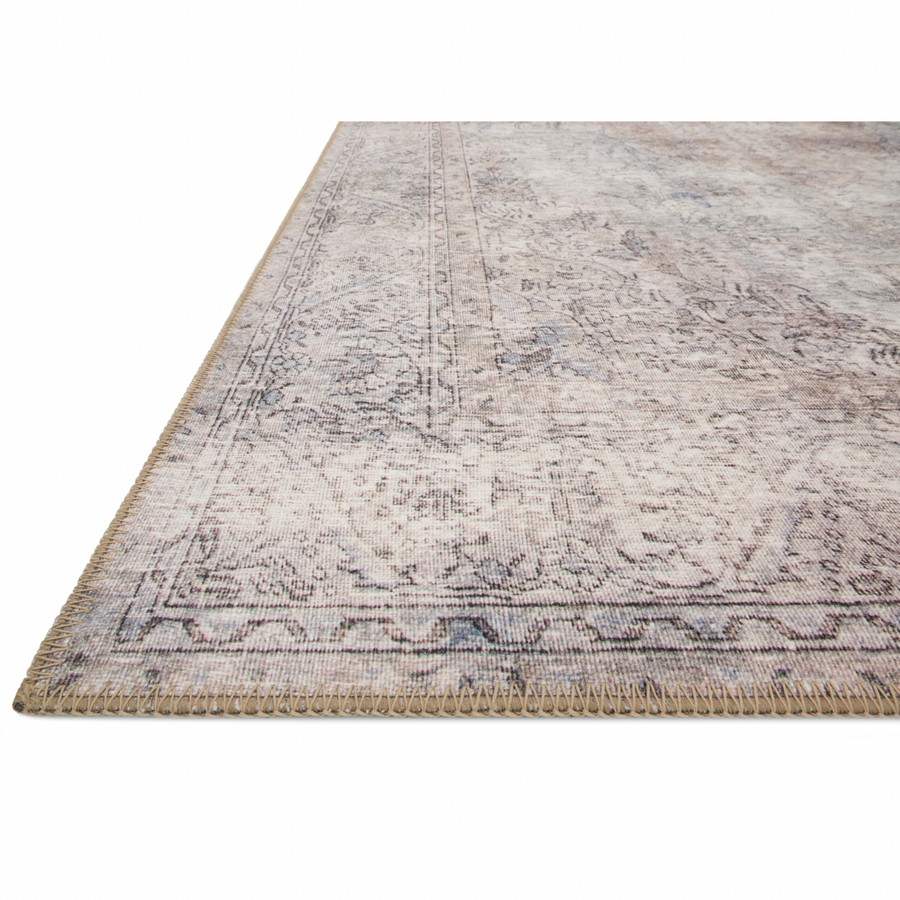 Timeless and classic, the Loloi Loren Silver/Slate Area Rug, or LQ-04, offers vintage hand-knotted looks at an affordable price. Created in Turkey using the most advanced rug-making technology, these printed designs provide a textured effect by portraying every single individual knot on a soft polyester base. 