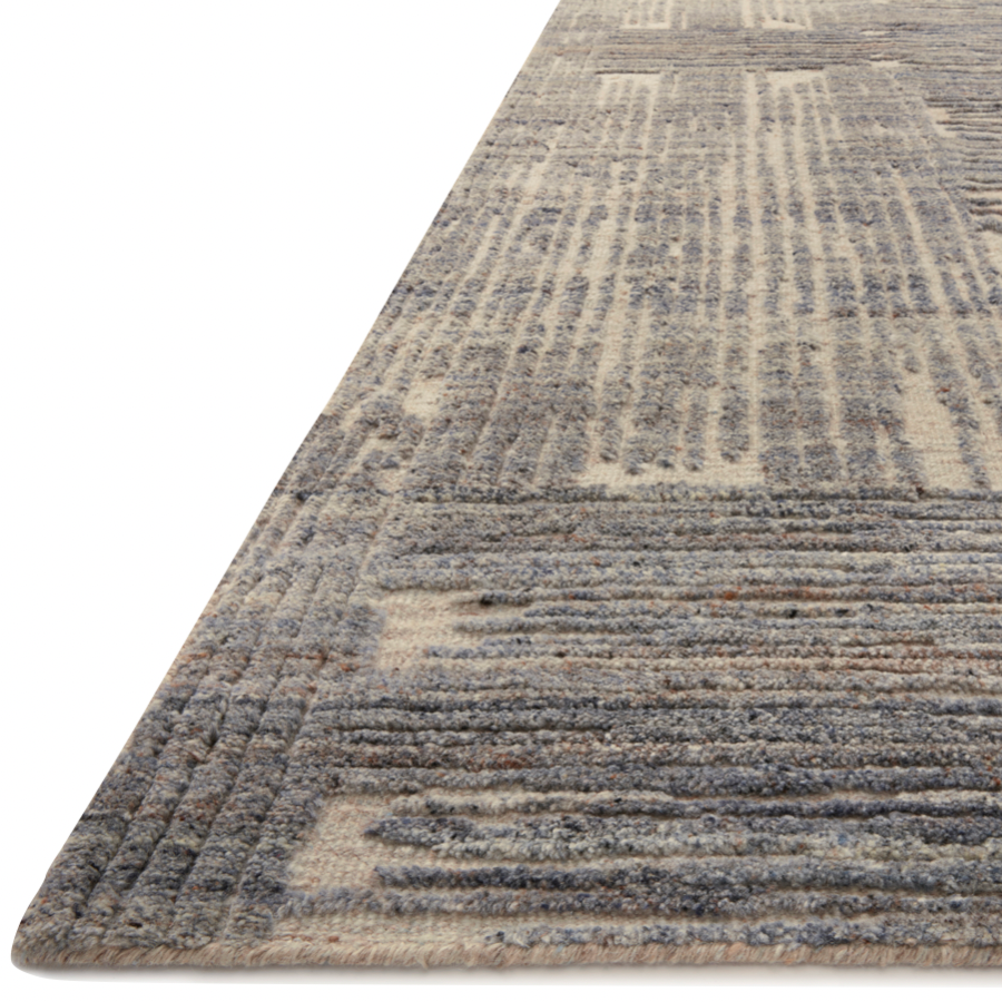 The Loloi Naomi Beige / Slate Area Rug, or NAO-06 is hand-knotted of wool and cotton by artisans in India. Naomi offers bold designs with earthy hues and features a high-low pile that adds depth and dimension, making each piece create the illusion of movement. A perfect rug for your living room, entryway, or other space