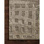 The Loloi Naomi Smoke / Ash Area Rug, or NAO-07 is hand-knotted of wool and cotton by artisans in India. Naomi offers bold designs with earthy hues and features a high-low pile that adds depth and dimension, making each piece create the illusion of movement. A perfect rug for your living room, entryway, or other space