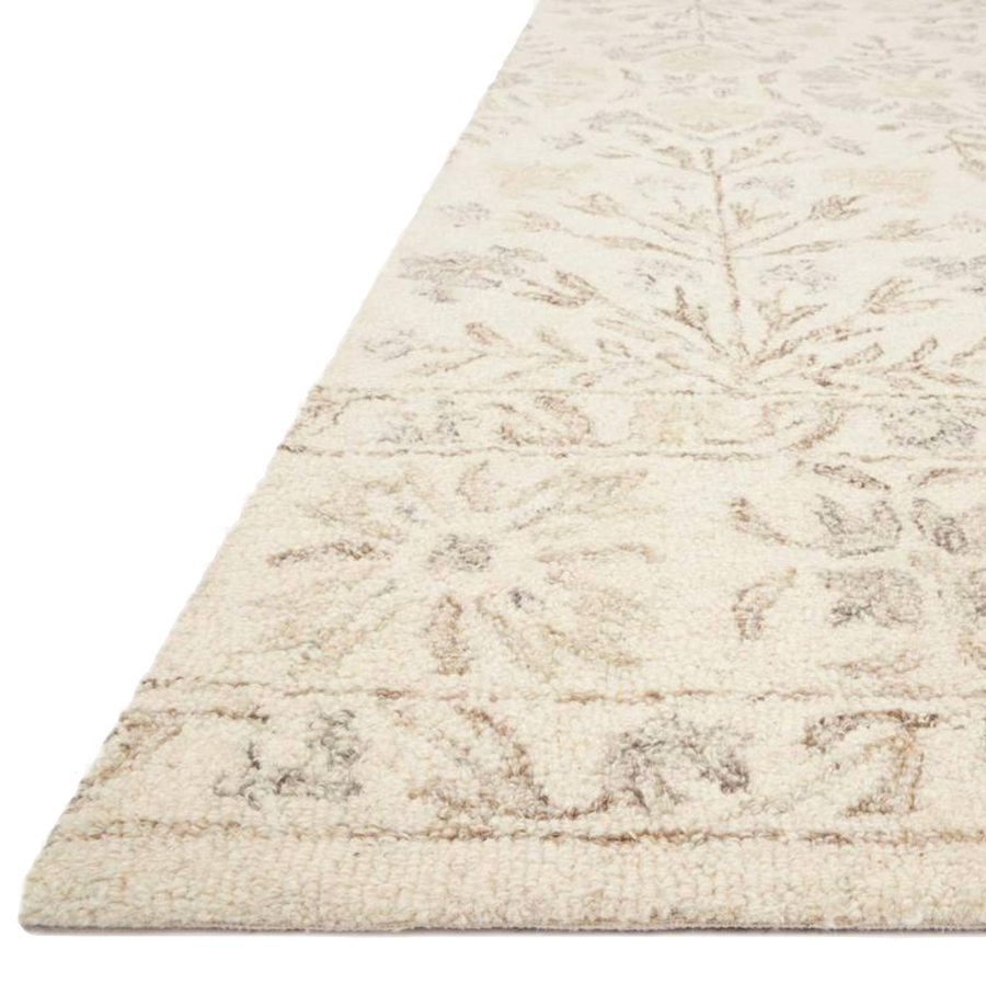 The Norabel Ivory / Neutral area rug from Loloi captures the balance of botanical motifs with delicate, varied colors of ivory and taupe. You will love this rug because the rug is:   Perfect for families with kids and pets Easy to clean and maintain Naturally soft and comfortable 100% wool Comes in big area rug sizes and as cute kitchen and hallway runners Looks gorgeous with the intricate botanical motifs Warms up any room with tones of ivory and taupe