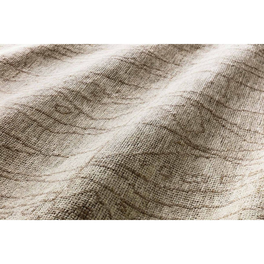 Drawing inspiration from tribal influences, the Odyssey Collection combines relaxed linear pattern with a sophisticated color palette. Each Odyssey rug, which is hand-knotted of wool and viscose from bamboo, is crafted entirely by hand by master artisans in India.  Hand Knotted 70% Viscose from Bamboo | 30% Wool OD-03 Sand/Taupe