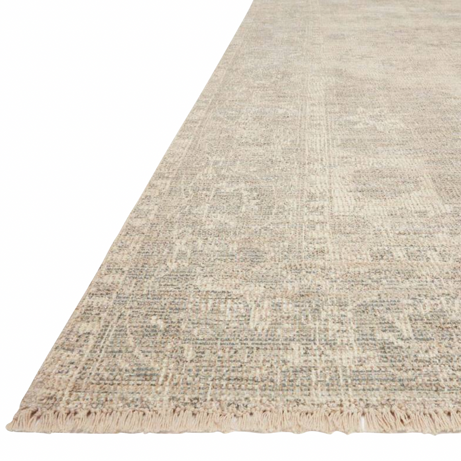 Hand-woven by skilled artisans, the Priya Ivory / Grey Area Rug from Loloi offers beautiful tonal designs accentuated by a carefully curated color palette. Delicate yet strong, Priya is an instant classic made for today's home.  Hand Woven 51% Cotton | 29% Polyester | 12% Viscose | 8% Wool PRY-04 Ivory/Grey Colors: Ivory, Grey