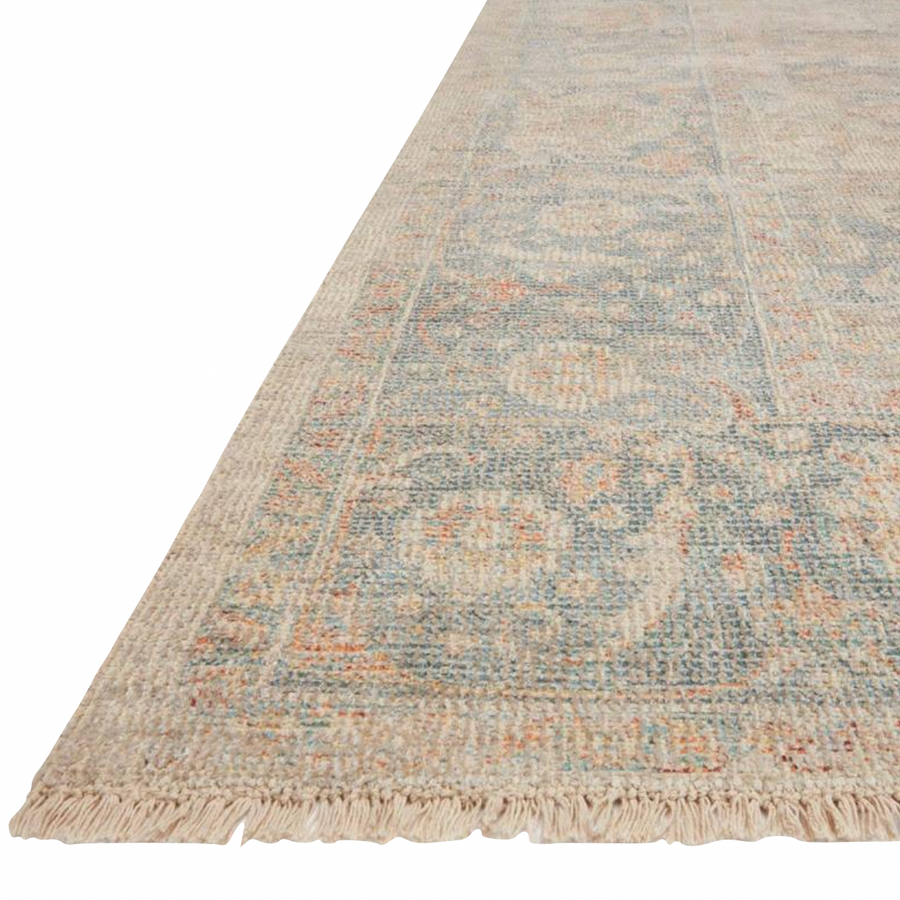 Hand-woven by skilled artisans, the Priya Bone / Bluestone Area Rug from Loloi offers beautiful tonal designs accentuated by a carefully curated color palette. Delicate yet strong, Priya is an instant classic made for today's home.  Hand Woven 51% Cotton | 29% Polyester | 12% Viscose | 8% Wool PRY-08 Bone/Bluestone Colors: Blue, Orange, Beige