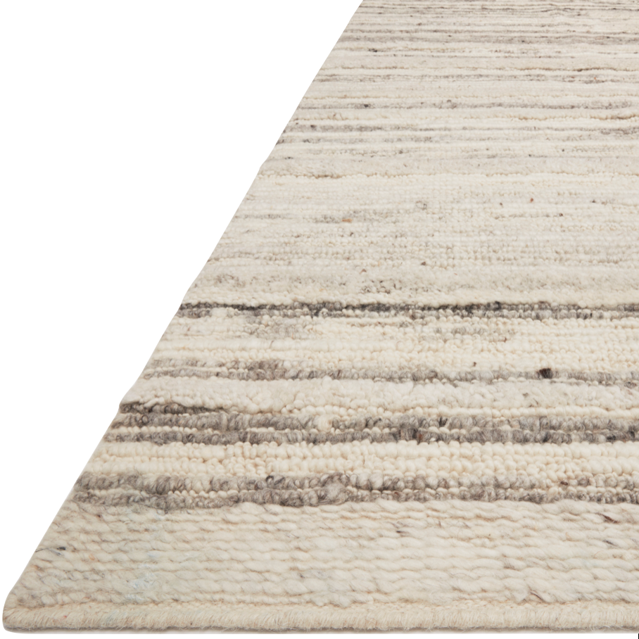 Hand-woven of 100% wool in India, the Loloi Rayan Natural / Grey Area Rug, or RAY-04, sets the tone for a calming atmosphere. Each design is crafted of textural highs and lows paired with neutral tones to create and engaging understatement. The perfect rug for your bedroom, office, or other medium traffic area. 