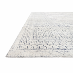 Hand-knotted in India of viscose and cotton, the Vestige White / Indigo Area Rug recalls ancient khotan rugs in an updated color palette. Soft underfoot, the silken yarns temper the graphic motifs to create a versatile foundation.  Hand Knotted 91% Viscose | 9% Cotton VQ-01 White / Indigo