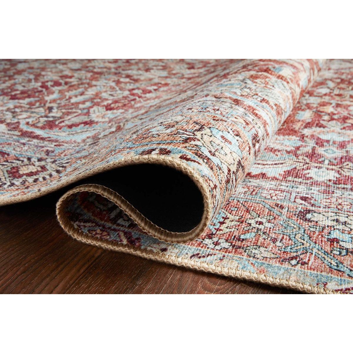 Old soul, new spirit. Power-loomed of 100% polyester, the Wynter Tomato / Teal area rug showcases a one-of-a-kind vintage or antique area rug look at an affordable price. This rug brings in tones of red, blue, orange, and hints of ivory, and ideal for high traffic areas due to the rug's durability. The rug is perfect for living rooms, dining rooms, kitchens, hallways, and entryways.  Power Loomed 100% Polyester WYN-05 Tomato/Teal Colors: Red, Orange, Blue, Ivory