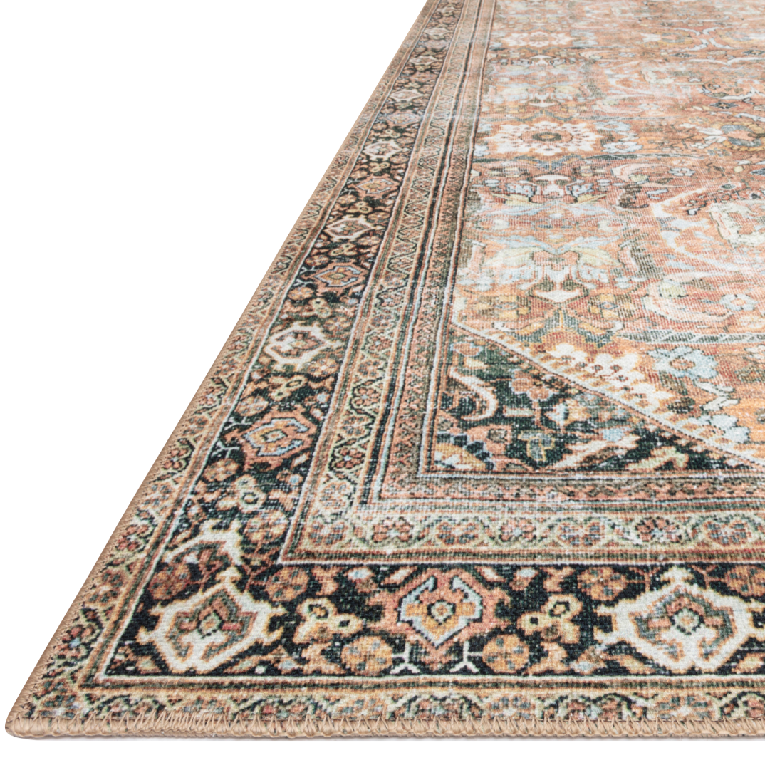 The Wynter Auburn / Multi area rug from Loloi captures the spirit of a one-of-a-kind vintage or antique area rug. You will love this rug because the rug is:   Perfect for families with kids and pets Very easy to clean and maintain Comes in big area rug sizes and as cute kitchen and hallway runners Looks gorgeous with the intricate pattern and patina Warms up any room with tones of orange, brown, black, and hints of blue Power Loomed 100% Polyester WYN-02 Auburn/Multi Colors: Orange, Brown, Black, Blue