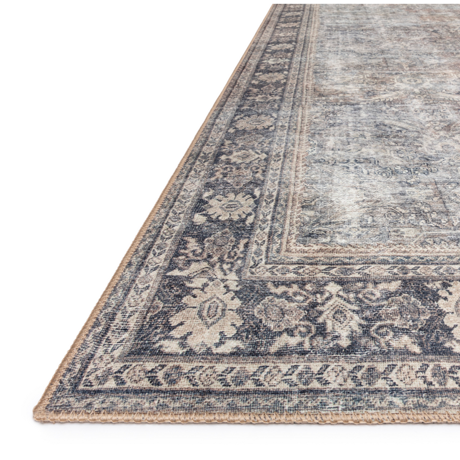 Old soul, new spirit. Power-loomed of 100% polyester, the Wynter Silver / Charcoal area rug showcases a one-of-a-kind vintage or antique area rug look at an affordable price. This rug brings in tones of silver, gray, blue, tan, and hints of green and ideal for high traffic areas due to the rug's durability. The rug is perfect for living rooms, dining rooms, kitchens, hallways, and entryways.  Power Loomed 100% Polyester WYN-03 Silver/Charcoal Colors: Silver, Gray, Blue, Tan, Green