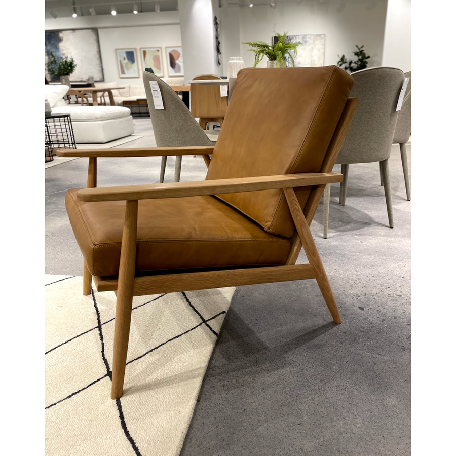 We love the contemporary look of this Harper Tan Leather Lounge Chair. The camel top grain leather elevates any living room, office, or lounge area.   Size:  26"W x 30.5"D x 28.5"H Seat Height: 18" Back Height: 19"