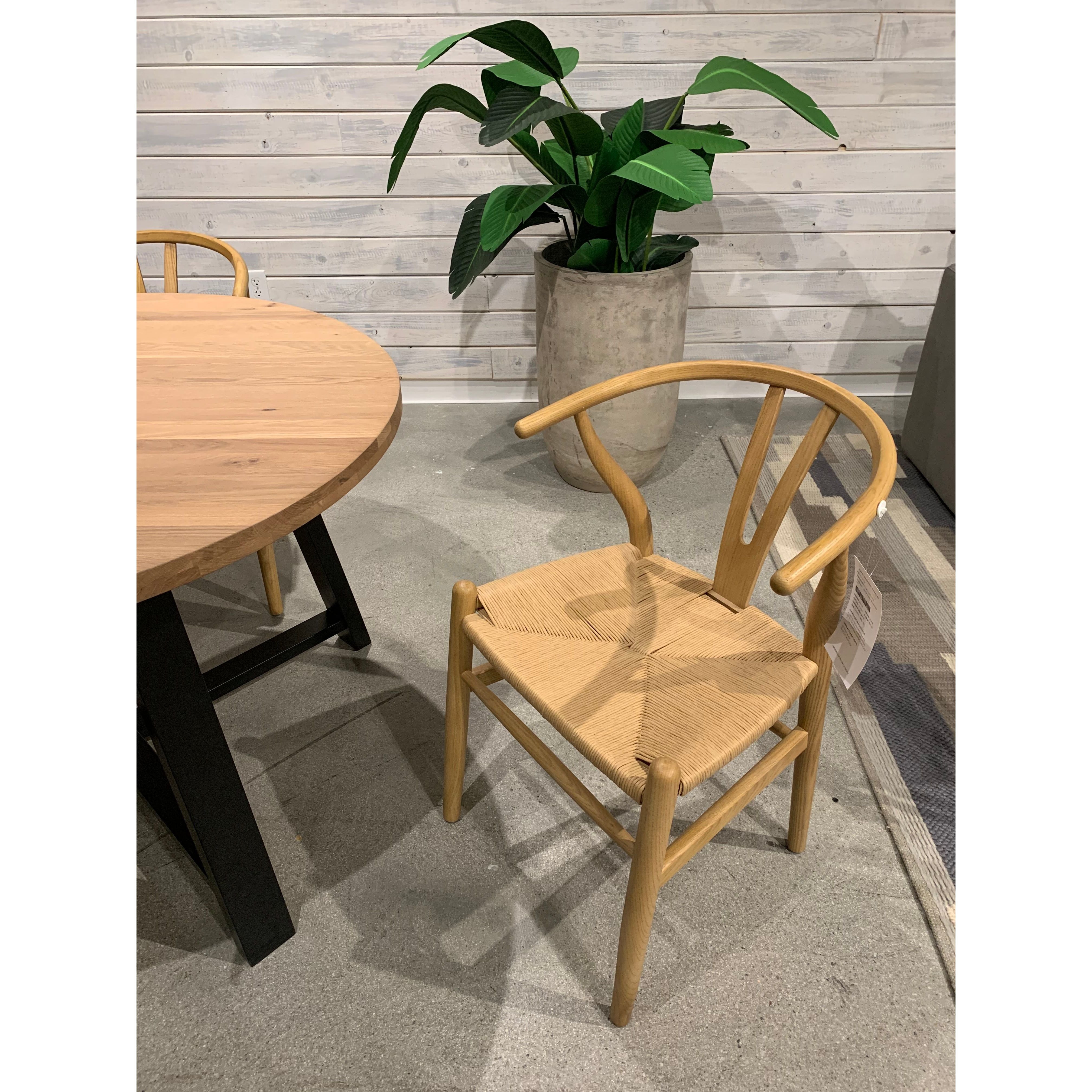 We loved the curved back and woven fibre seat of this this Ventana Black Dining Chair. Simple and sturdy, this is an easy choice for your dining room.   Size: 19.5"W x 16.5"D x 31"H