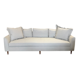 The lovely Nina Sofa is a Verellen best seller! Bench-crafted in North Carolina, it features spring down seat construction, loose bench seat cushion, slipcover style (finishing stitch in place of hemline on slipcover), and standard upholstered legs.