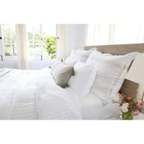 The Blake Duvet Collection White/Ocean by Pom Pom at Home features an interwoven stripe texture, giving a modern refresh to a traditional stripe. Our duvet and shams are hand-loomed by artisans and the linen is washed for a relaxed lived-in look for any bedroom.    Inserts sold separately 100% linen Shell-button closure Machine wash cold; tumble dry low; warm iron as needed. Do not bleach