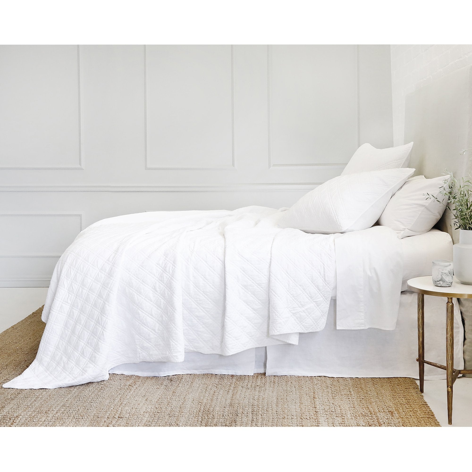 The Brussels Coverlet Bedding White by Pom Pom at Home is a grand and sophisticated line that has a diamond quilted pattern on the front, made of 100% stone washed cotton velvet. Available in several soft, stone washed colors.  100% cotton velvet Machine wash cold; tumble dry low; warm iron as needed Do not bleach