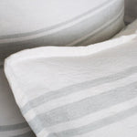 The Jackson Duvet Collection White/Ocean by Pom Pom at Home is a very casual and clean line. It features a series of ocean subtle stripes on white that create a simple and fresh look.  Its duvet cover and shams are finished with tie closures.   Inserts sold separately 100% linen Machine wash cold; tumble dry low; warm iron as needed Do not bleach