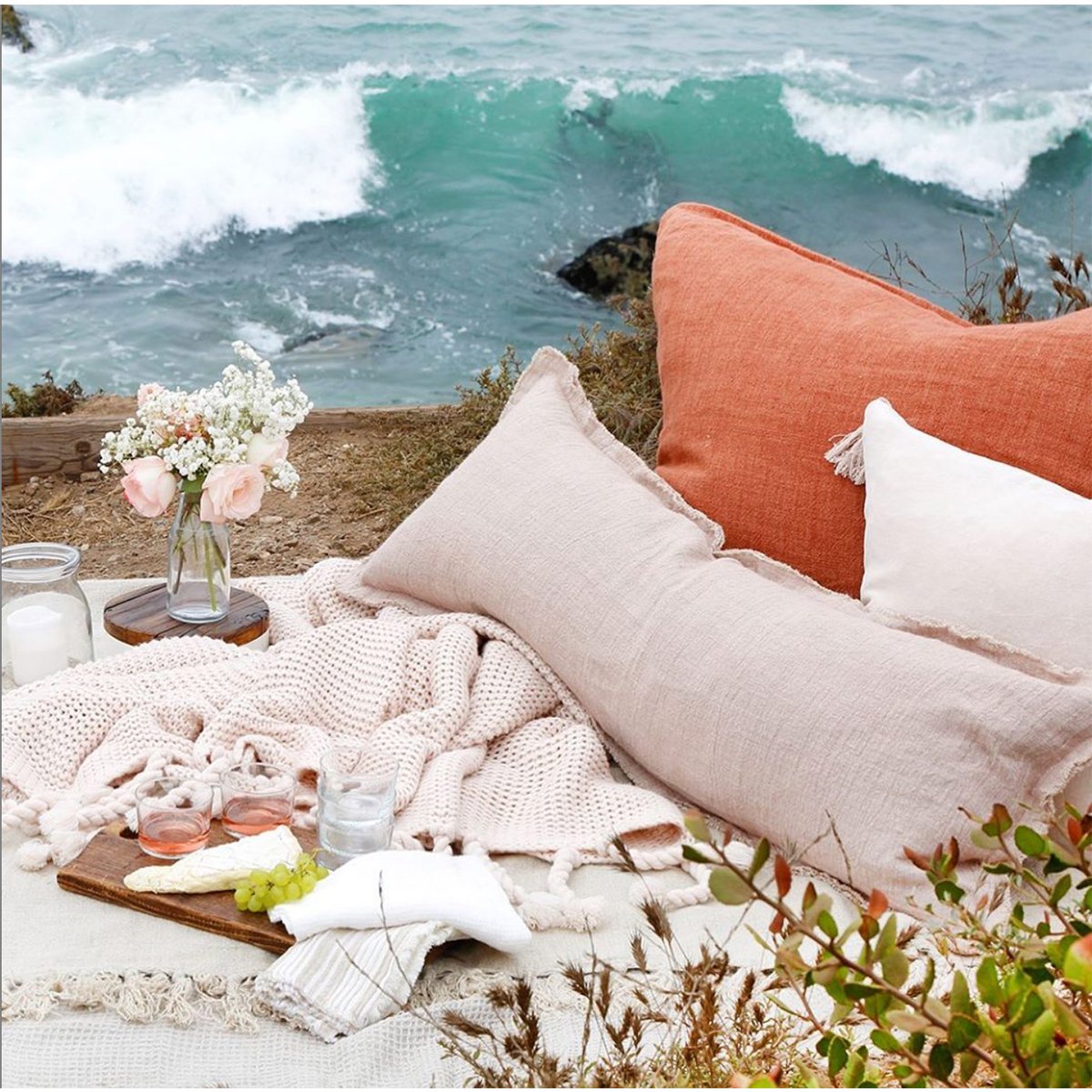 The Laurel Blush 14x40 Pillow with Insert is a beautiful, stonewashed linen with frayed edges.   Details & Care: 100% Linen  Machine Wash cold: tumble dry low: warm iron as needed. Insert Included 