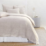 Subtle frayed edges of soft linen add a dash of unexpected detail to this Logan Duvet Collection Terra Cotta by Pom Pom at Home. Woven with two different colored yarns for a heathered effect, the duvet cover and shams feature shell button closures.  Inserts sold separately 100% linen Shell-button closure Machine wash cold; tumble dry low; warm iron as needed. Do not bleach