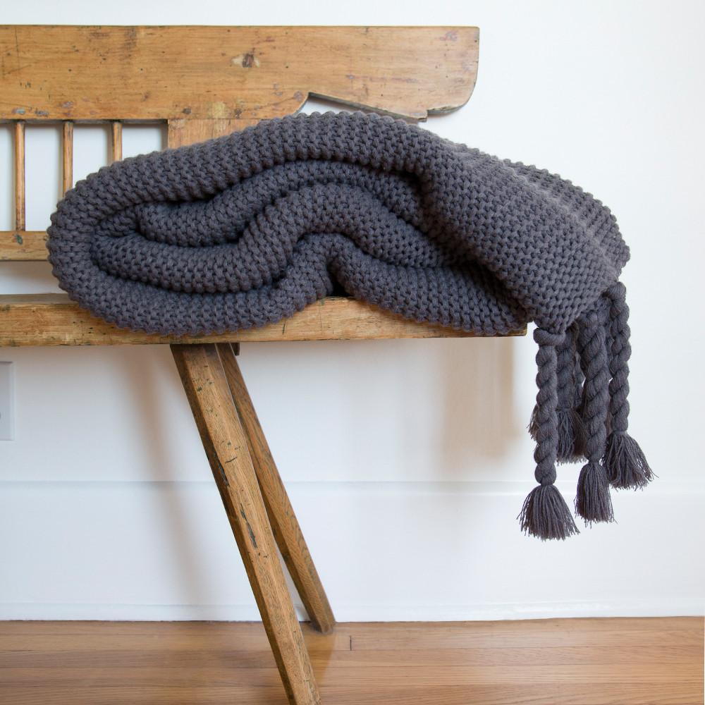 Indulge in this oversized cable-knit throw complemented with a tassel design. This Trestles Overside Throw - Three Colors by Pom Pom at Home is the perfect throw to wrap yourself with or dress at the foot of the bed.