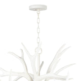 The resin Antler Chandelier wears a modern, matte white finish. Hang in a living room, kitchen, dining area or office to create a modern-lodge feel.  Dimensions: 21.5"h x 33"w x 33"d