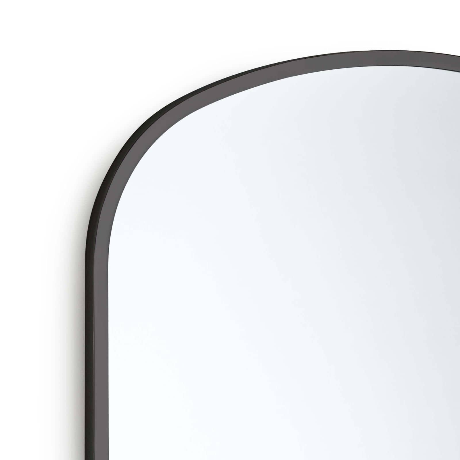 We love the arched metal frame of this Cloak Mirror. Place in your entryway, living room, or bedroom and bring a sleek, sophisticated look to the space!   Overall Size: 26"w x 0.75"d x 30"h