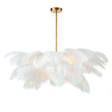 A boho dream and definite statement piece -- we are obsessed with the white feathers of this Josephine Feather Chandelier! We'd love to see this hung in a bedroom, over a dining table, or any other space of your home needing a chic statement.  Overall size: 37.25"w x 37.25"d x 22.5"h