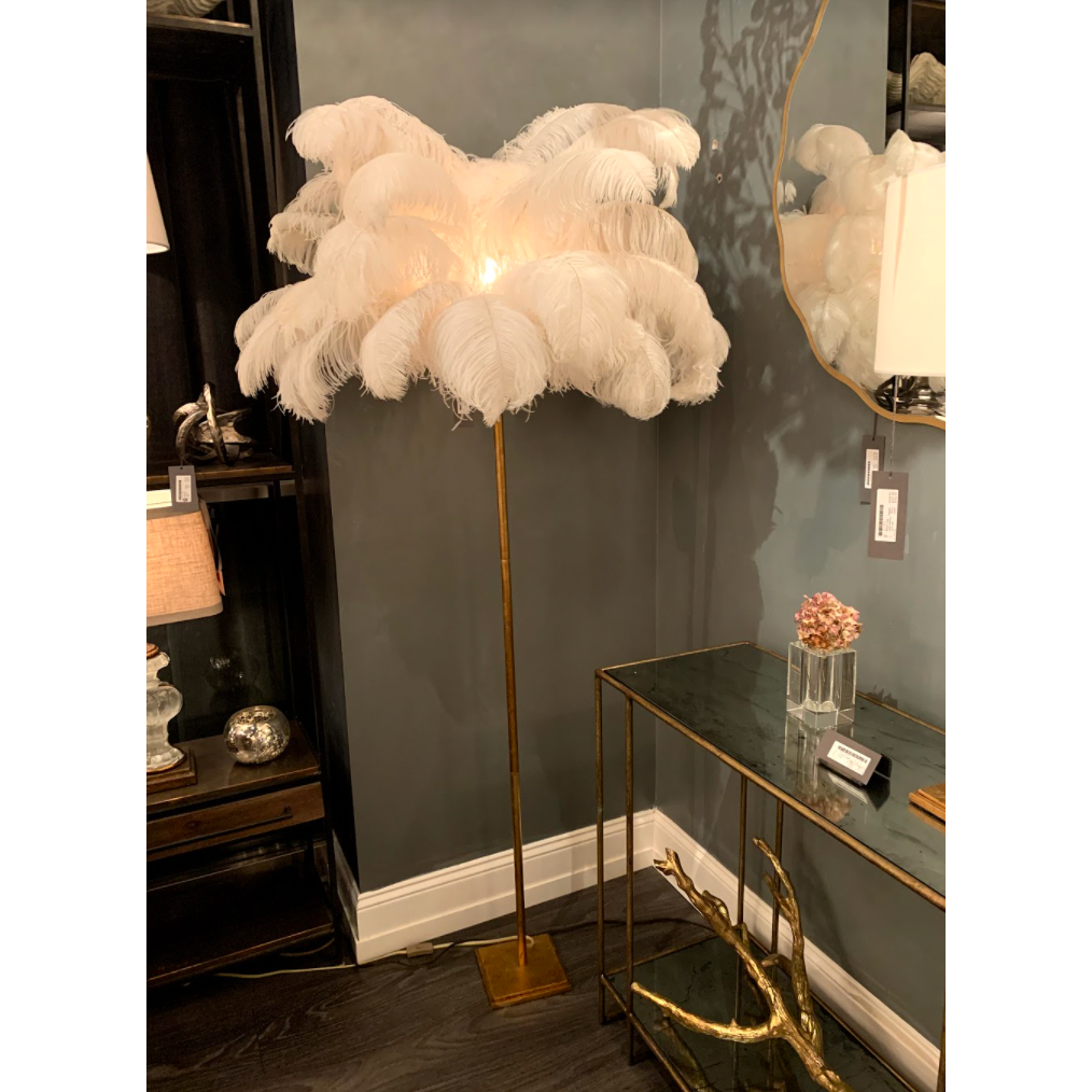 Feather your nest with the Josephine Floor Lamp, romantic and feminine this sultry lamp will make a statement in your bedroom or living room. It's elegant gilded gold base supports real Ostrich feathers.    Overall Dimensions: 35"w x 35"d x 70"h