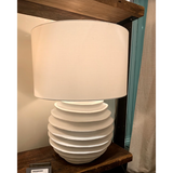 We love the accordion-like base of this Nabu Metal Table Lamp. It is a simple and beautiful lamp that adds warmth to any room.  Size: 18"w x 18"d x 24.5"h